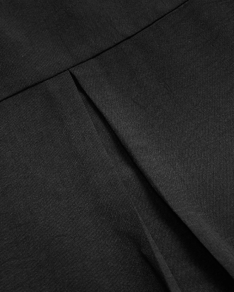 Avslappnad topp med paljettknappar med panel