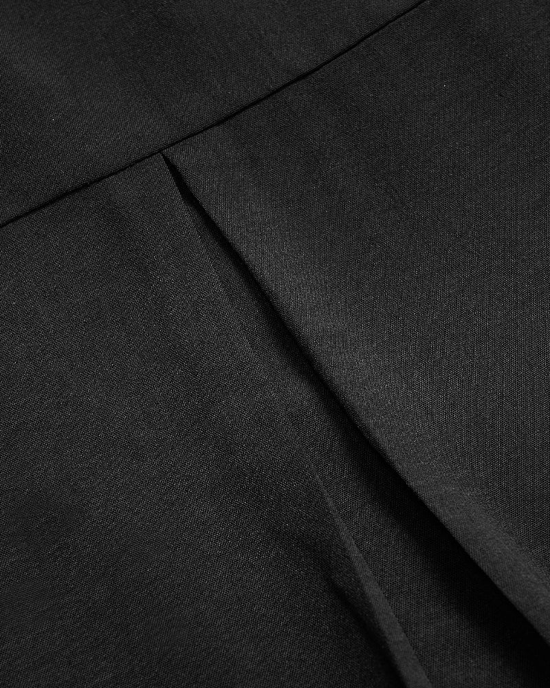 Avslappnad topp med paljettknappar med panel