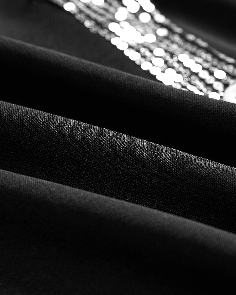 Avslappnad topp med paljettknappar med panel