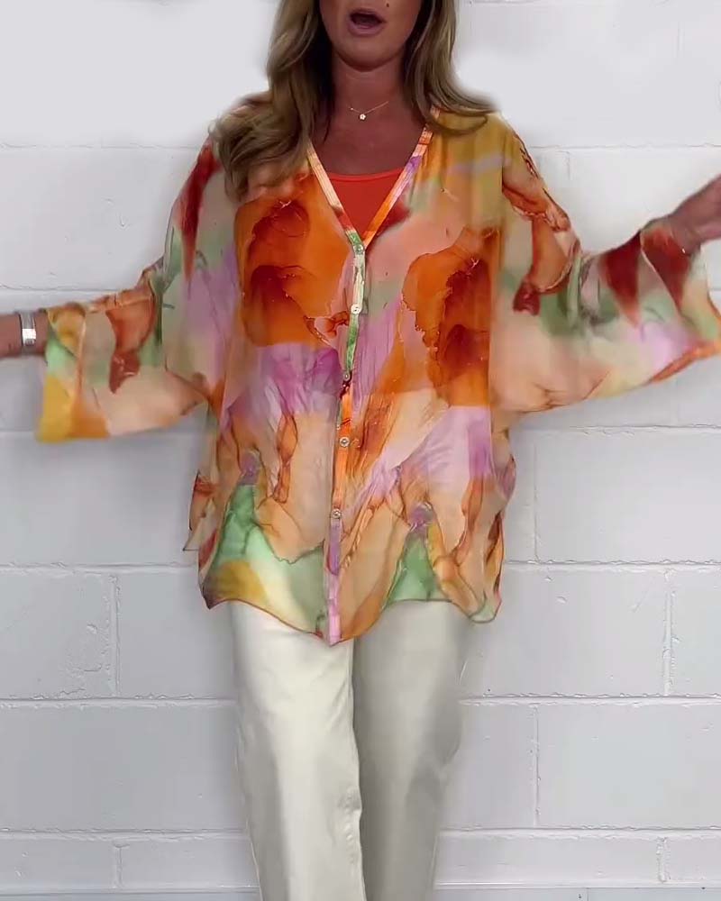 Avslappnad blus med V-ringning och lång ärm